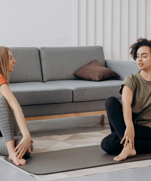 Woman in a calm, seated yoga pose, embodying balance and inner strength.